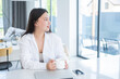 © Юля Шевцова - smiling young asian woman in white shirt with cup of tea or coffee and laptop at modern home