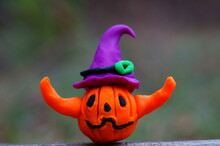 A Pumpkin Figurine In A Festive Hat. A Halloween Symbol. A Festive Event.