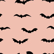 Silhouettes of bats seamless pattern on color background. Halloween design for baby clothes, bedding, textiles, print, wallpaper.