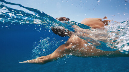 Man swimming in the calm sea