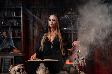 Halloween, witch use magic book and cauldron prepare poison or love potion