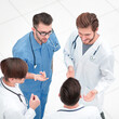 © ASDF - view from the top. team of doctors discussing the problems