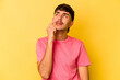 © Asier - Young caucasian man isolated on yellow background crying, unhappy with something, agony and confusion concept.