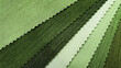 samples of fabric for interior upholstery or drapery works in green tone color. swatch of violet zigzag pattern fabric. fabric for luxury interior style. close-up image.
