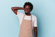 © Asier - Young african american store clerk isolated on blue background touching back of head, thinking and making a choice.