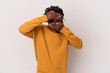 © Asier - Young african american man isolated on white background  blink at the camera through fingers, embarrassed covering face.