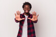 © Asier - Young african american man isolated on white background  showing number ten with hands.