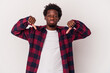 © Asier - Young african american man isolated on white background  showing a dislike gesture, thumbs down. Disagreement concept.