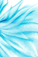 Wall Mural - closeup of the wavy blue turquoise organza fabric