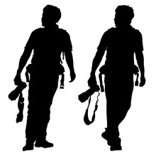A Full-length Male Photographer Walks Forward, Carries A Camera In His Right Hand, Looks To The Right. Vector Black Silhouettes Isolated On White Background. 2 Options