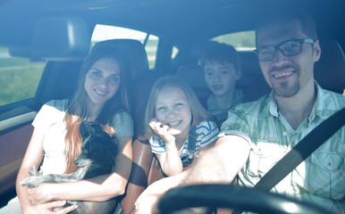 Wall Mural - happy family rides in the car