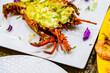 Prepared spiny lobster on a plate. Exotic seafood