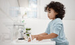 © N Felix/peopleimages.com - Kids need to keep their hands clean. Shot of an adorable little boy washing his hands at a tap in a bathroom at home.