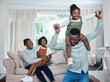 Fun is all they have planned for the day. Shot of a happy family having fun while relaxing together at home.