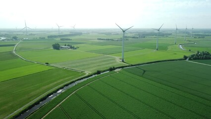 Wall Mural - view of landscape with greenfields and windmills in the Netherlands