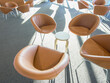 © SuperStock - Tan leather chairs and tables in public waiting area