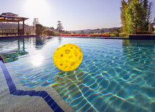 Inflatable Ball Floating In Swimming Pool