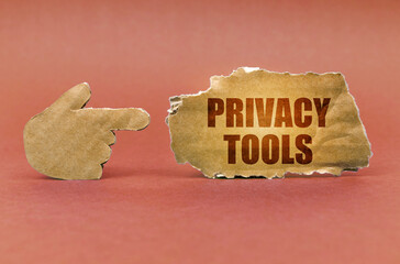 Poster - On a brown surface, a cardboard hand points to a sign that says - Privacy Tools