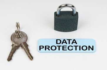 Poster - On a white surface there is a lock, keys and a blue sign with the inscription - Data protection