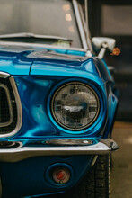 Classic Ford Mustang Convertible In Blue, Parked In The City. Ford Mustang Is One Of The Most Famous Cars In The USA And Is An Icon Of Muscle Cars In The World.
