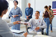 © Seventyfour - Portrait of smiling woman with disability receiving voting ballot on election day