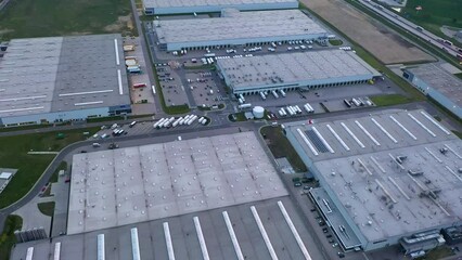 Wall Mural - Aerial view of many logistics warehouses in industrial areas, loading and unloading goods for online store, online delivery