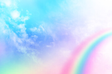 Colorful sky with soft white clouds and the crossing of rainbows. pastel colored magical fantasy background. Sweet Dreams concept for Wallpaper, Backdrops and Design.