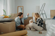 © Halfpoint - Cheerful young couple in their new apartment. Conception of moving.