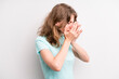 teenager young girl covering eyes with hands with a sad, frustrated look of despair, crying, side view