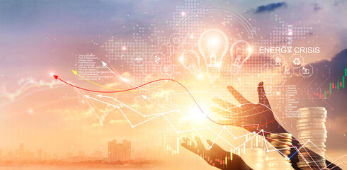 energy crisis, hands touch light bulb with energy resources icon and rising graph data chart represe