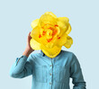 canvas print picture Woman with yellow narcissus flower instead of her head on light background