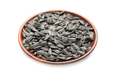 Plate With Unpeeled Sunflower Seeds On White Background