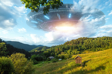 Wall Mural - ufo, an alien saucer hovering over the mountains in the clouds, hovering motionless in the sky. unid