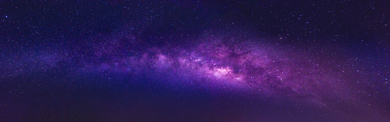 Wall Mural - milky way in the night sky and stars on a dark background with noise. with long exposure shooting