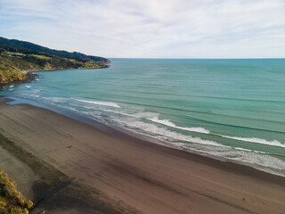 Wall Mural - Black sand beaches of Raglan, West coast of New Zealand 