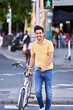 © JoseIMartin - Man crossing the road at pedestrian crossing walking with his bicycle. High quality photo