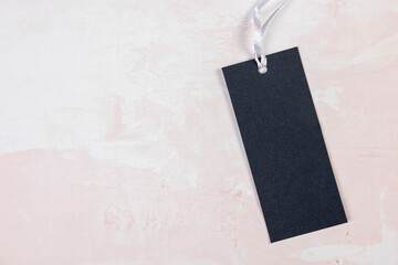 Wall Mural - Clothing tag, label blank mockup template on a marble pink table