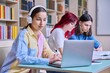 © Valerii Honcharuk - Group of teenage students study in school library