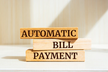 Poster - Wooden blocks with words 'AUTOMATIC BILL PAYMENT'. Business concept