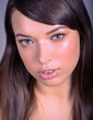 Very Tight Close-up of Beautiful Caucasian Woman With Cat Blue Eyes and Full Shinny Lips