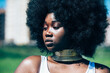 © ADDICTIVE STOCK - African female in traditional golden necklace in nature