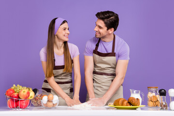 Canvas Print - Portrait of two peaceful positive people hands make dough pizza pie isolated on purple color background