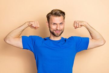 Sticker - Photo of young man show arms muscles training workout exercise regime isolated over beige color background