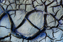 Textured Background Of Cracked Soil