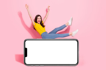 Full length profile photo of excited crazy person sit empty space blank rise hands isolated on pink color background