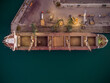© sandsun - Aerial view of big cargo ship bulk carrier is loaded with grain of wheat in port at sunset