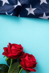 Wall Mural - Concept of Independence day or Memorial day. American Flag over blue table background with red rose.