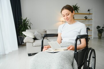 Young woman in wheelchair at home