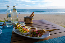 Thai Food On A Table On The Beach In Thailand. Table With Thai Food Thai Sate