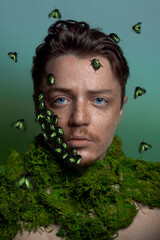 Beautiful man with green bettles on his face